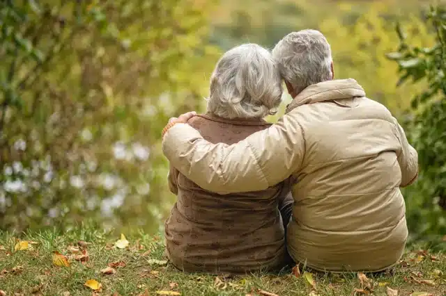 Senior couple enjoying retirement after successfully managing medical school debt through financial planning