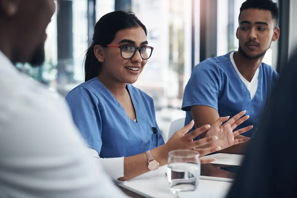 Doctor meeting with financial advisor discussing debt repayment strategy