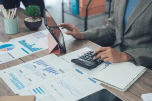 Professional accountant analyzing bookkeeping data to reduce in-house bookkeeping costs